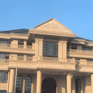 镇江黄金麻别墅外墙干挂石材效果示例